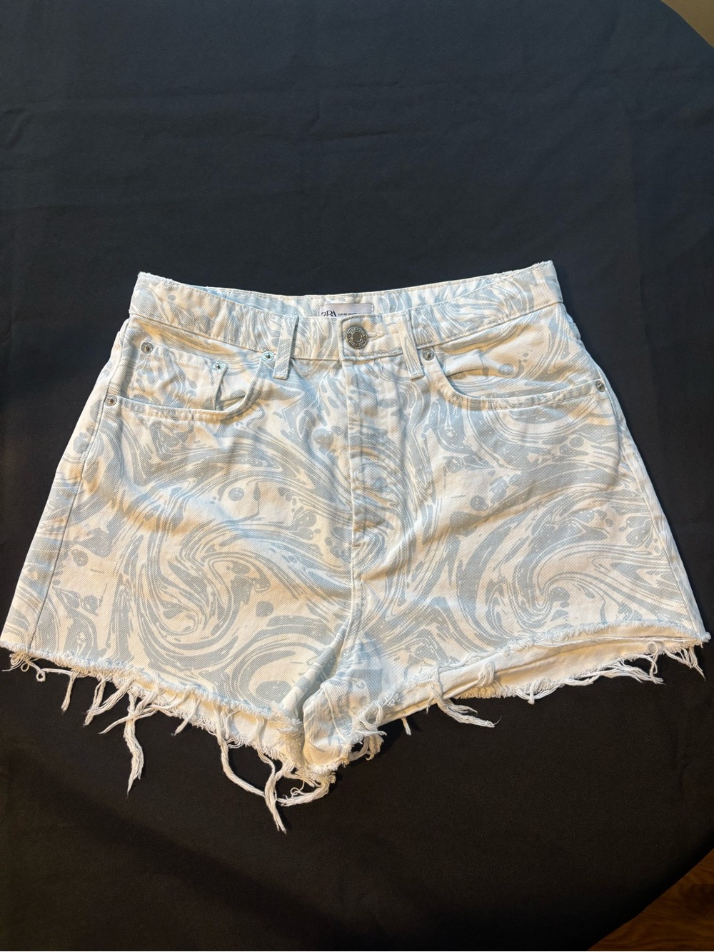 High-Waist Swirl Print Denim Cut-Off Shorts in Light Blue and White, Size 8